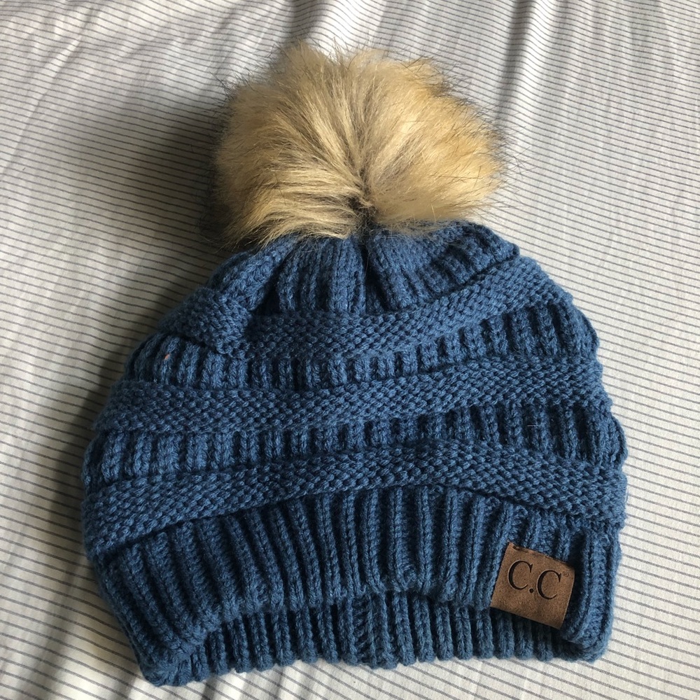 Never worn blue pompom beanie